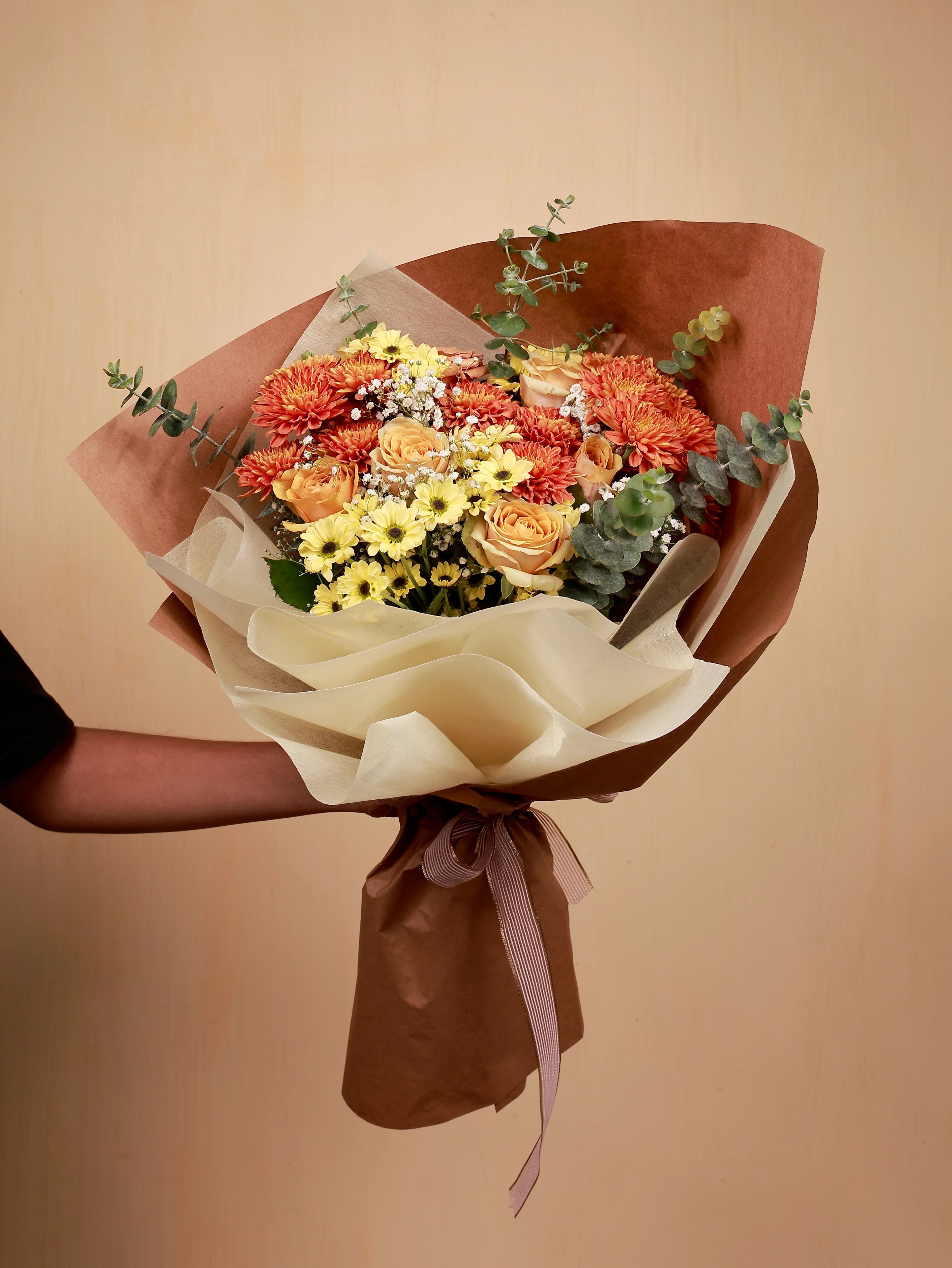 A bouquet of orange and yellow flowers
